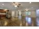 Open-concept floorplan with hardwood floors seamlessly connecting the living and kitchen spaces at 4507 N Peachtree Rd, Dunwoody, GA 30338