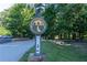 A charming Brook Run Park sign with the Dunwoody Trailway logo greets visitors at the entrance of the community at 4507 N Peachtree Rd, Dunwoody, GA 30338