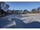 A well-maintained community skate park with various ramps, rails, and a covered seating area at 4507 N Peachtree Rd, Dunwoody, GA 30338
