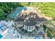 Aerial view of the property's clubhouse and tennis courts at 4507 N Peachtree Rd, Dunwoody, GA 30338