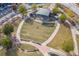Aerial of the tiered seating for the Suwanee Town Center amphitheater, bordered by sidewalks and trees at 486 Raven Brook Ln, Suwanee, GA 30024