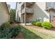 Backyard featuring patio, landscaping, and a view of the home's exterior at 486 Raven Brook Ln, Suwanee, GA 30024