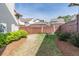 Fenced backyard with lush landscaping, green grass, and privacy at 486 Raven Brook Ln, Suwanee, GA 30024