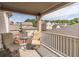 Relax on this covered outdoor balcony with seating, and enjoy neighborhood views at 486 Raven Brook Ln, Suwanee, GA 30024