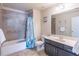 Full bathroom with ceramic tile, vanity, tub, and shower combination at 486 Raven Brook Ln, Suwanee, GA 30024