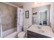 Bathroom featuring a shower-tub combo with decorative shower curtain and vanity with mirror at 486 Raven Brook Ln, Suwanee, GA 30024