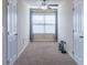 This bedroom has carpet floors and a ceiling fan at 486 Raven Brook Ln, Suwanee, GA 30024