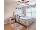 Cozy bedroom with a ceiling fan and decor for a room at 486 Raven Brook Ln, Suwanee, GA 30024