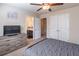 This bedroom features a ceiling fan, a closet, and an ensuite bathroom at 486 Raven Brook Ln, Suwanee, GA 30024