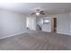 A spacious bonus room with plush carpet and neutral walls at 486 Raven Brook Ln, Suwanee, GA 30024