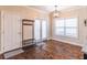 Bright dining area with french doors and large window to let in lots of natural light and hardwood flooring at 486 Raven Brook Ln, Suwanee, GA 30024