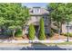 Charming brick home with well-maintained landscaping and mature trees in a desirable neighborhood at 486 Raven Brook Ln, Suwanee, GA 30024
