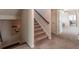 Inviting hallway with carpeted stairs and an open view to the main bedroom and bathroom at 486 Raven Brook Ln, Suwanee, GA 30024