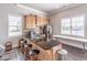 Fully equipped kitchen area with granite countertops, wood cabinets, and stainless steel appliances at 486 Raven Brook Ln, Suwanee, GA 30024