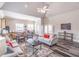 Bright living room with a view of the kitchen and dining area at 486 Raven Brook Ln, Suwanee, GA 30024
