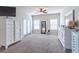 Spacious main bedroom featuring two dressers and sliding glass door to the outside at 486 Raven Brook Ln, Suwanee, GA 30024