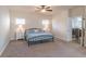 Spacious main bedroom featuring an ensuite bathroom and lots of natural light at 486 Raven Brook Ln, Suwanee, GA 30024