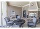 Comfortable outdoor seating area with a stone fireplace and seating arrangements at 486 Raven Brook Ln, Suwanee, GA 30024