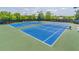 Well-maintained community tennis courts for sports and active lifestyles at 486 Raven Brook Ln, Suwanee, GA 30024