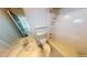 Bathroom featuring a single sink vanity and shower-tub combo with shelving at 6948 Dalehollow Dr, Lithonia, GA 30058