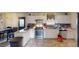 Kitchen with white cabinets, stainless steel appliances, and tile backsplash at 6948 Dalehollow Dr, Lithonia, GA 30058