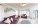 Living room with neutral walls, plush furniture, and abundant natural light at 6948 Dalehollow Dr, Lithonia, GA 30058