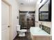 Modern bathroom featuring a glass shower, unique sink, and decorative mosaic tile accents at 1062 Meadow Grass Ln, Powder Springs, GA 30127