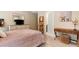 Bedroom with a comfortable bed, stylish decor, and natural light at 1062 Meadow Grass Ln, Powder Springs, GA 30127