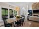 Light-filled dining area with views of outdoor patio and comfortable seating at 1062 Meadow Grass Ln, Powder Springs, GA 30127