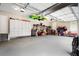Well-organized garage equipped with cabinets, storage racks, and ample space for parking and hobbies at 1062 Meadow Grass Ln, Powder Springs, GA 30127