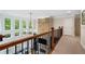 Bright hallway with a stone fireplace, and large windows at 1062 Meadow Grass Ln, Powder Springs, GA 30127