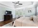 Relaxing main bedroom with hardwood floors, tray ceilings, and comfortable decor at 1062 Meadow Grass Ln, Powder Springs, GA 30127