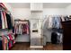 Spacious walk-in closet with organized shelving and ample storage space at 1062 Meadow Grass Ln, Powder Springs, GA 30127