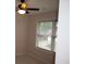 Comfortable bedroom with a ceiling fan and window view at 1120 Lake Lucerne Rd, Lilburn, GA 30047