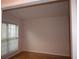 Bedroom featuring natural light from a window and hardwood floors, creating a bright and inviting space at 1120 Lake Lucerne Rd, Lilburn, GA 30047