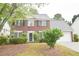 Charming two-story brick home with a well-manicured front yard at 1120 Lake Lucerne Rd, Lilburn, GA 30047