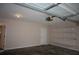 Spacious two-car garage with shelves, and door leading to the main house at 1120 Lake Lucerne Rd, Lilburn, GA 30047