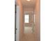 Hallway leads to a bedroom with natural light streaming through the window at 1120 Lake Lucerne Rd, Lilburn, GA 30047