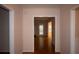 Hallway with hardwood floors and neutral walls connecting to various rooms of the home, creating seamless flow at 1120 Lake Lucerne Rd, Lilburn, GA 30047