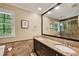 Bathroom with a double vanity, granite countertop, dark wood cabinets, and a large mirror at 2253 Creekstone Ct, Marietta, GA 30062
