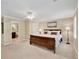 Spacious primary bedroom with a large bed, ensuite bathroom and lots of natural light from two windows at 2253 Creekstone Ct, Marietta, GA 30062