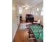 Bright bonus room with a foosball table, desk, and plenty of natural light at 2253 Creekstone Ct, Marietta, GA 30062