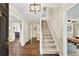 Inviting foyer with hardwood floors and a staircase leading to the upper level of the home at 2253 Creekstone Ct, Marietta, GA 30062