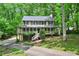 Charming two-story home features a welcoming front porch and a serene, wooded setting at 2253 Creekstone Ct, Marietta, GA 30062