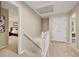 Hallway with carpet and stairway to the bedrooms with white doors, trim and a view into a bedroom at 2253 Creekstone Ct, Marietta, GA 30062