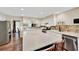 Bright kitchen with white cabinetry, stainless steel appliances, and stone backsplash at 2253 Creekstone Ct, Marietta, GA 30062
