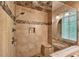 Walk-in shower with a shower head and rainfall shower, tiled and a tiled seat at 2253 Creekstone Ct, Marietta, GA 30062