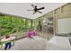 Inviting sunroom filled with natural light from large windows and featuring laundry appliances and a play area at 2253 Creekstone Ct, Marietta, GA 30062