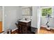 Compact bathroom features a vanity with sink and a window, offering practical space at 230 Seamarsh Ct, Atlanta, GA 30328
