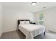 Bright bedroom with white walls, a bed, and a window offering natural light at 230 Seamarsh Ct, Atlanta, GA 30328